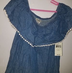 A denim cold shoulder top